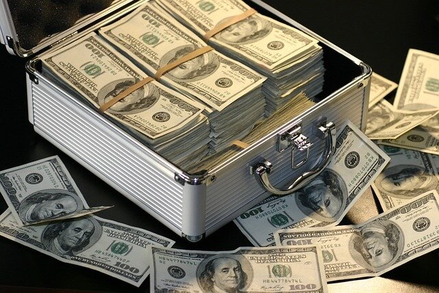 Aluminum case full of dollars